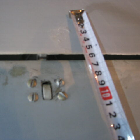 A ruler and some buttons on the floor