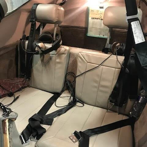 A view of the back seats in an airplane.