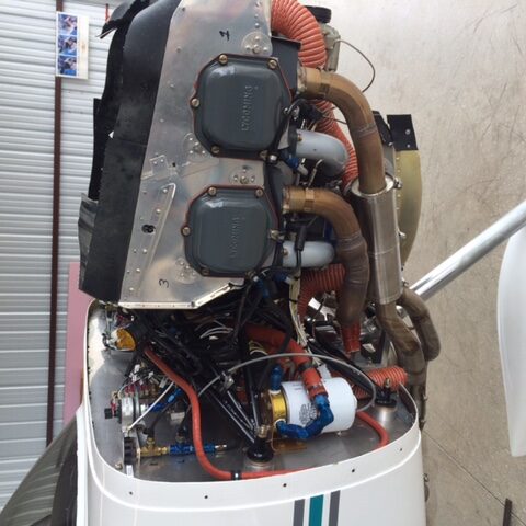 A view of the inside of an airplane showing the engine.